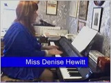 Click to hear Miss Denise Hewitt play Pachelbel's Canon in D  - Denise is wearing her favourite deep blue evening dress!